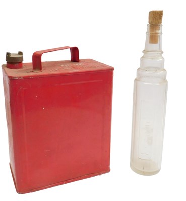 Lot 81 - An Essolube one quart oil bottle, and a five...