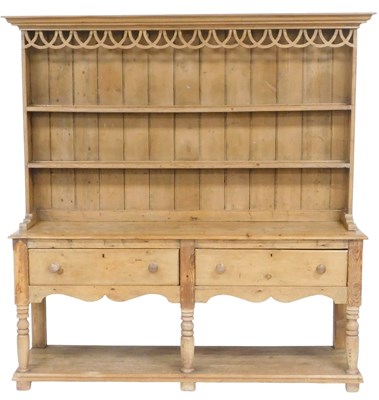 Lot 21 - A Victorian stripped pine dresser, with a...