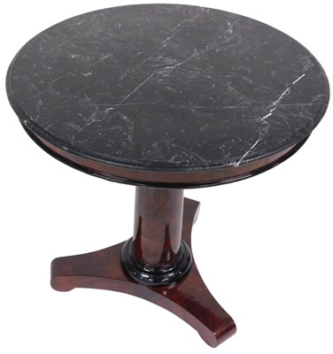Lot 57 - A flame mahogany centre table, witha  black...