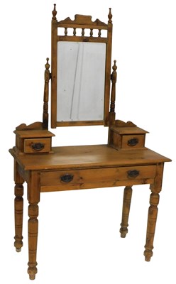 Lot 62 - A Victorian stripped pine dressing table, with...