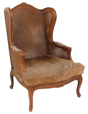 Lot 88 - A French walnut armchair, with doubled cane...