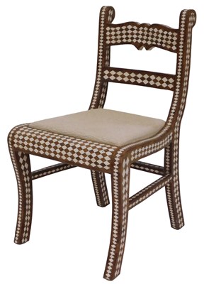 Lot 89 - An Anglo Indian style chair with sabre legs,...