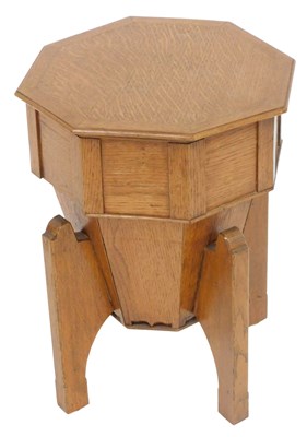 Lot 121 - An octagonal oak box stool, with lift top as a...