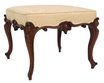 Lot 124 - A Victorian walnut stool, with a carved frieze...