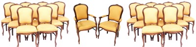 Lot 128 - A set of twenty Louis XV style oak dining...