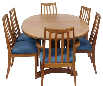 Lot 129 - A G-Plan teak dining suite, comprising six...