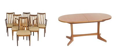 Lot 130 - A G-Plan teak dining suite, comprising six...