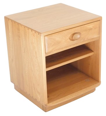 Lot 25 - An Ercol light elm bedside cabinet, 55cm high,...