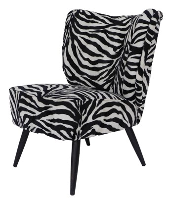 Lot 146 - A low armchair with faux zebra skin upholstery.