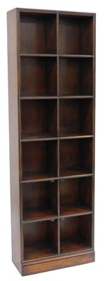 Lot 166 - A hardwood bookcase, with applied brass front...