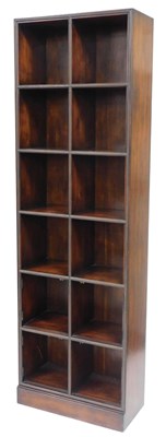 Lot 167 - A hardwood bookcase, with applied brass front...