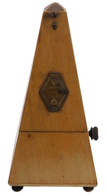 Lot 136 - A Maezel wooden cased metronome, 23cm high.