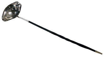 Lot 214 - A Georgian toddy ladle, inset with a George II...