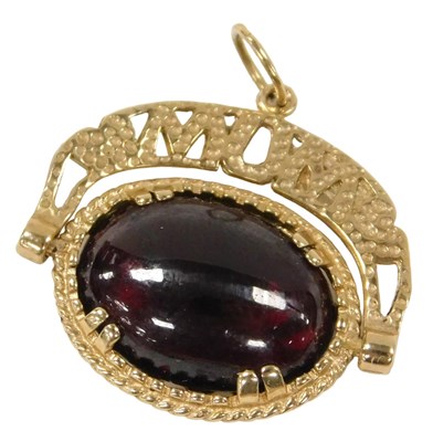 Lot 278 - A 9ct gold and red cabochon swivel fob pendant,...