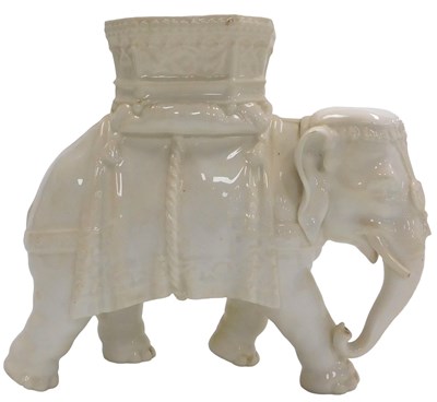 Lot 312 - A late 19thC white glazed porcelain elephant...