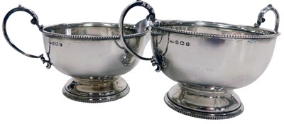 Lot 341 - A George V silver cream jug and sugar bowl,...