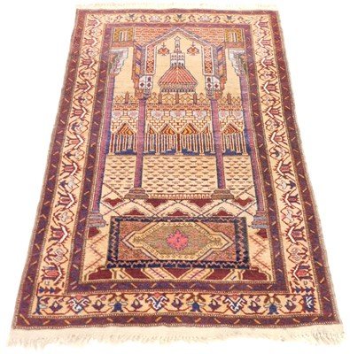 Lot 399 - A Baluch peach ground prayer rug, the mihrab...