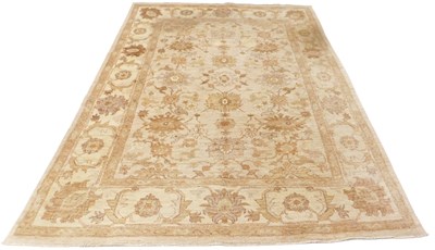 Lot 400 - A Turkish Oushak rug, on a pale brown ground,...