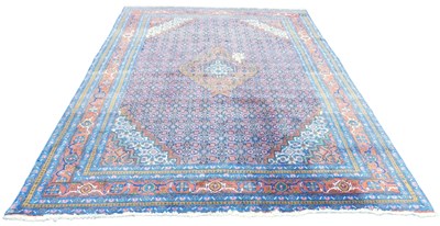 Lot 411 - A Tabriz Maralan blue ground rug, decorated to...