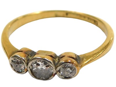 Lot 414 - A diamond three stone ring, set with rose cut...