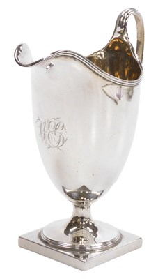 Lot 422 - A George III silver helmet shaped cream jug,...