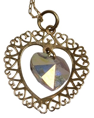 Lot 426 - A 9ct gold and crystal heart shaped pendant,...