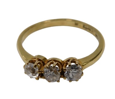 Lot 12 - A three-stone diamond dress ring, set with...