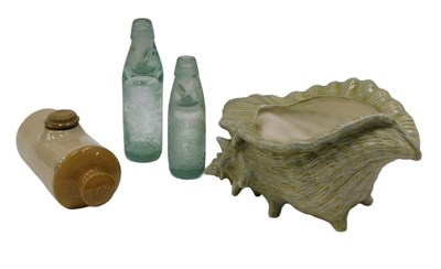 Lot 140 - A green glass bottle with marble Verity & Co...