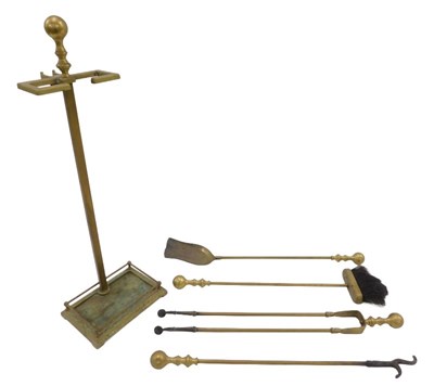 Lot 200 - An early 20thC brass fireside companion...