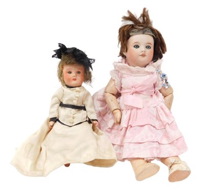 Lot 220 - An early 20thC bisque headed doll, with...