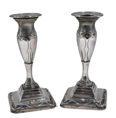 Lot 258 - A pair of Edwardian silver candlesticks,...
