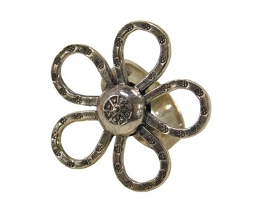 Lot 99 - A flower dress ring, the elaborate five petal...