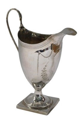Lot 277 - A George III silver helmet shaped cream jug,...