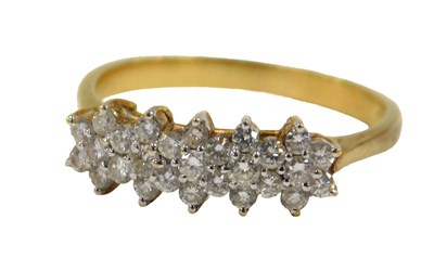Lot 79 - A diamond cluster ring, the ring head set with...