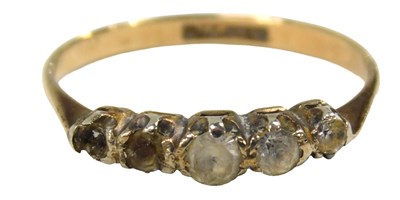 Lot 50 - A five stone dress ring, set with four...