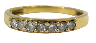 Lot 57 - An 18ct gold diamond half hoop dress ring, set...