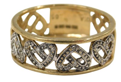 Lot 58 - A 9ct gold eternity ring, of pierced heart...