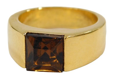 Lot 68 - A modern finish gold plated dress ring, with...