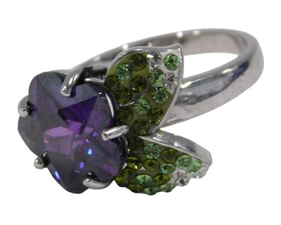 Lot 356 - A silver dress ring, set as a purple flower...