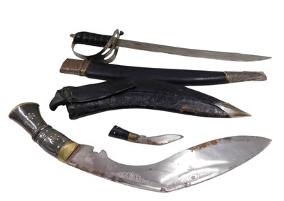 Lot 459 - An early 20thC kukri, with etched curved blade,...