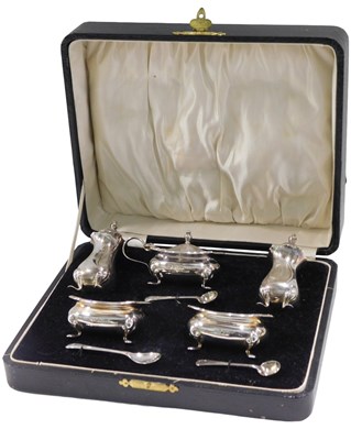 Lot 389 - A George V silver five piece cruet set, by...