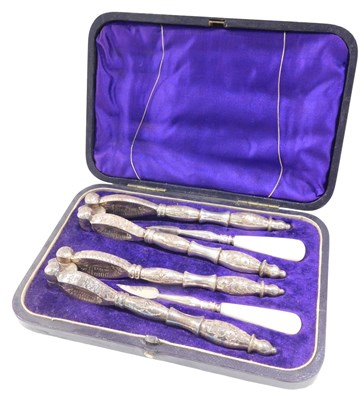 Lot 412 - An early 20thC silver plated nutcracker and...