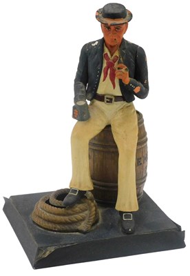 Lot 539 - A 20thC figure group of a seated sailor on...