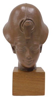 Lot 647 - A model of Tutankhamun's head, mounted on a...