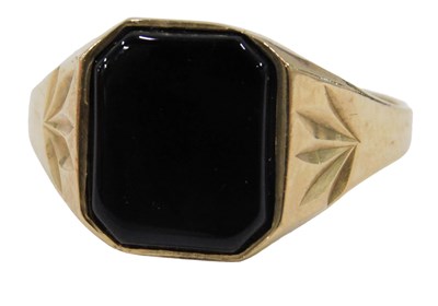 Lot 682 - A 9ct gold signet ring, set with polished...