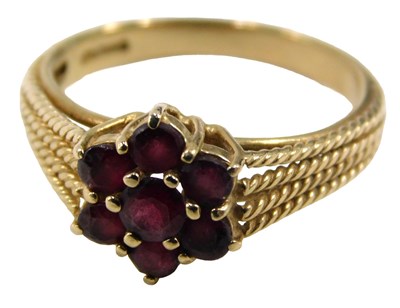 Lot 680 - A 9ct gold garnet cluster ring, set with seven...
