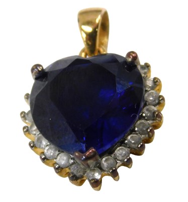 Lot 681 - A heart shaped pendant, set with blue and...
