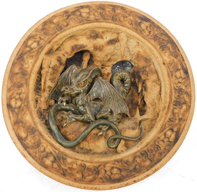 Lot 570 - A Studio pottery wall plaque, dragon in...