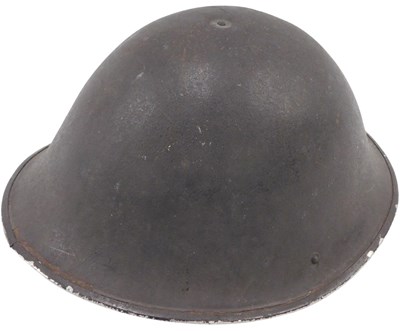 Lot 575 - A 20thC British post WW2 army helmet, with...