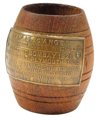 Lot 587 - A teak barrel, with metal plaque reading HMS...